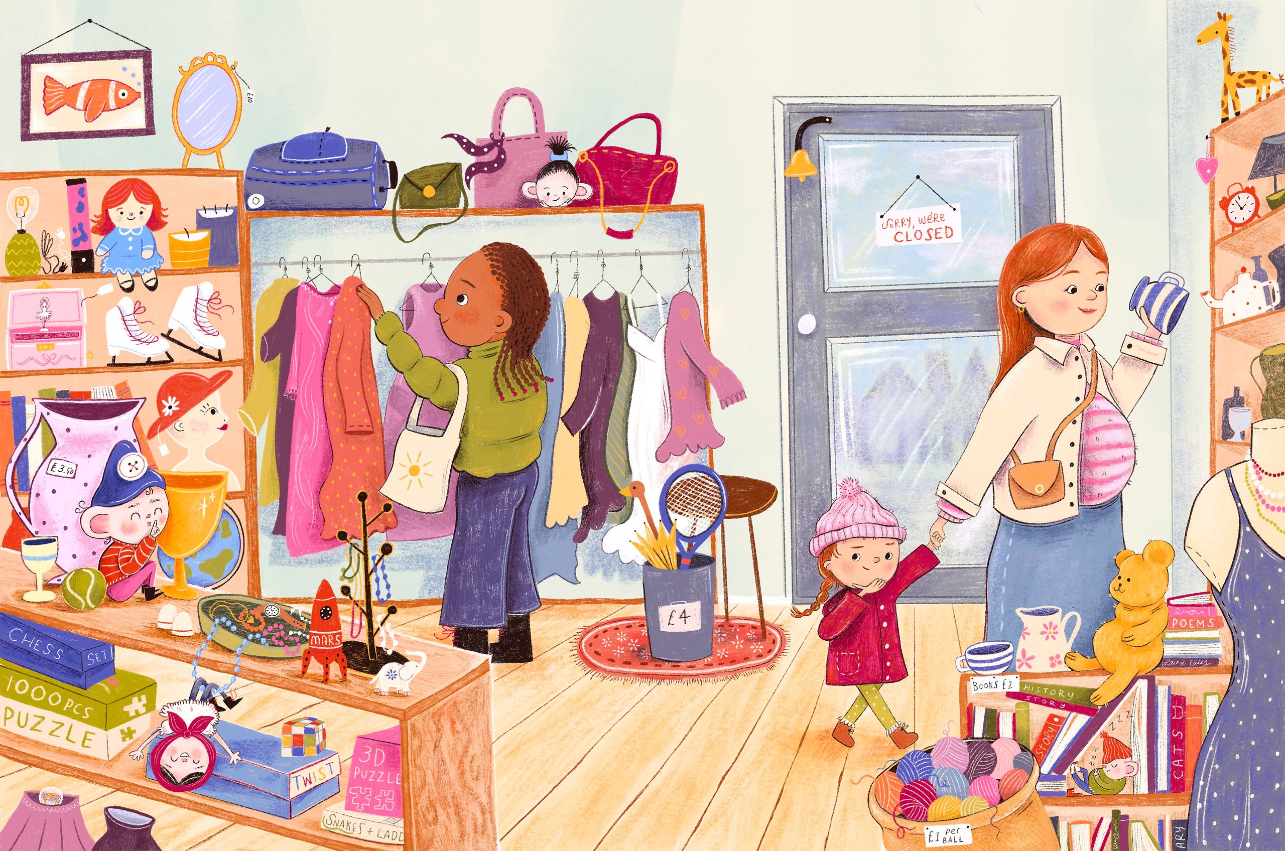 A busy charity shop interior. A woman in a green jumper browses a rail of pink and purple clothes, a red-haired woman holds up a striped mug, and a small girl in a red coat and bobble hat is led past by the hand. Shelves overflow with bric-a-brac — a lava lamp, ice skates, a chess set, a jigsaw, a teddy bear and a basket of wool — and tiny mice and dolls hide among the objects.