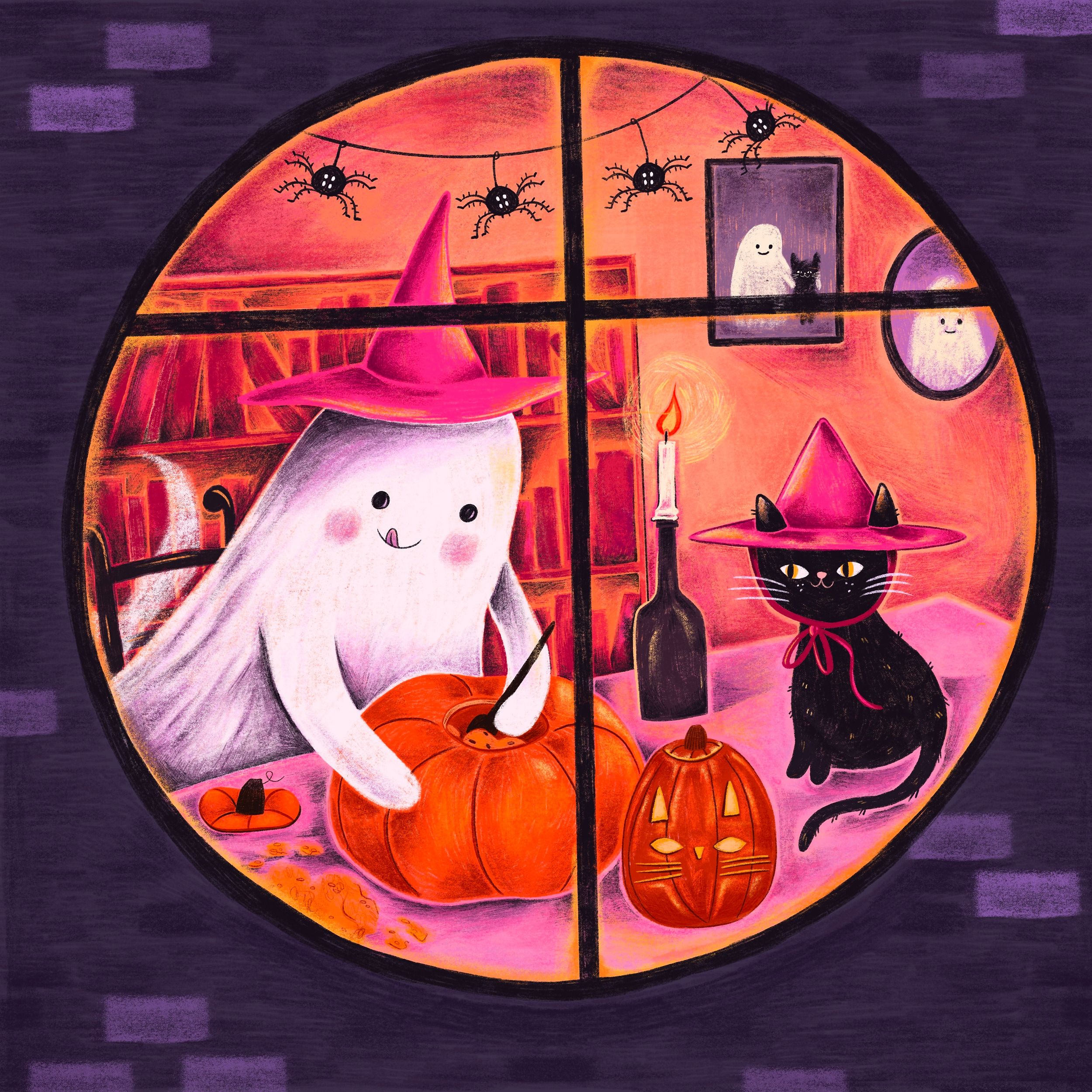 Seen through a round window at night, a small ghost in a pink witch's hat leans over a pumpkin with a carving knife, seeds scattered on the table. A black cat in a matching hat and ribbon sits beside a finished jack-o'-lantern and a candle. Paper spiders hang on threads above, and two more ghosts peer out of a framed portrait and a mirror on the wall.